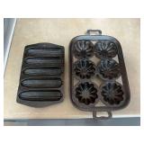 Two cast iron muffin tins.