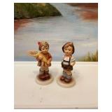 Hummel figurines No. 630- A sweet offering and No. 549 school boy. Goebel Germany.