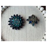 Two blue rhinestone and silver brooches