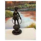 Bronze figure of a young girl holding a hula hoop by artist Ferdinand Preiss