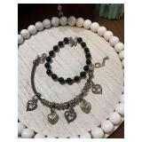 Vintage Onxy and Sterling silver beaded bracelet and a black and silver charm bracelet with hearts