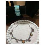 Blue mother-of-pearl Abalone shell stretch bracelet and a Ayala Bar multicolored necklace.