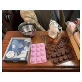 KitchenAid hand mixer with three stainless mixing bowls, cookie press, and Easter silicone candy trays