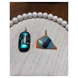 2 Dichroic fused glass artist pendant in Orange and blues and black, green and blues.