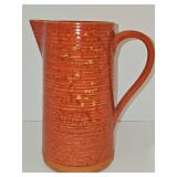 Terracotta pouring pitcher made by Molde company in Portugal. 9.5 in tall. Pitcher is not damaged. It is their unique design.