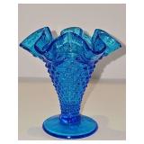 3.75 in tall Fenton Colonial Blue Hobnail Footed Vase with a ruffled rim.