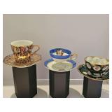 Three cup and saucer sets.