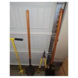 Hand tools. Two shovels, garden claw, and loppers.