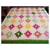 Machine stitched quilt top ready for backing, batting, and to be quilted. Vibrant pink/green/white colors, cross plus variation pattern, watermelon, pineapple, flamingos, flowers, fern, approx 92" x 8
