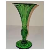 Emerald green EAPG depression era trumpet vase with fluted rim and twisted design base. 7 3/8 in tall.