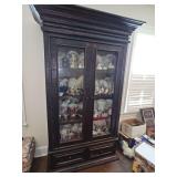 Antique(?) hand-hewn cabinet with two glass front doors and two drawers. 51 x 18.5 x 91 in tall. Contents are NOT included.