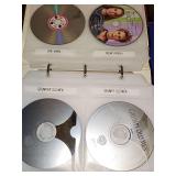 Album of comedy movies. Will show several. The album is full. Approximately 67 DVD