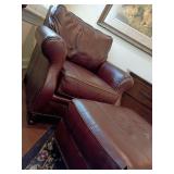 Broyhill traditional oxblood top-grain leather club chair, matching rectangular ottoman. Rolled arms, brass nailhead trim, turned wooden bun foot or spindle leg. Comfort!