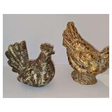Two roosters. One has a weathered look, one has a gold wash finish. 7.5 in tall and 9.75 in tall