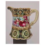 antique Nippon hand-painted porcelain pitcher (late 19th - early 20th century), featuring heavy raised moriage (raised slip) decoration and intricate gilding. Top opening is 4.75-in diameter x 7.75 in