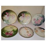 Six porcelain 8-9 in plates with roses.