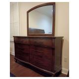 La Jolla Bedroom Dresser with beveled Mirror B1033B-050 the Royal Classics brand, a premium division of New Classic Furniture. 6 drawers, Rich Chocolate / Ranchero Brown with bronze strap accents. Har