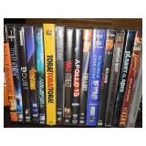 Grouping of DVDs as shown. Clear unmarked case contains Indiana Jones raiders of the Lost ark, Temple of doom, and last crusade. Citizen Kane and Tora Tora Tora are unopened.