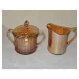 Marigold carnival Glass covered sugar and creamer.