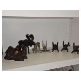 Grouping of brass and iron animals. Camel, moose, deer, crickets/katydids.