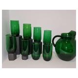 Anchor Hocking Forest Green Roly-Poly Glass Pitcher with eight 5 in tall glasses. Sticker residue on front of picture near ice lip.