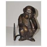Bronze look thinking monkey ring holder with long tail. 4.25 in tall.