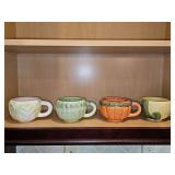 Set of four "vegetable" mugs. Cauliflower, asparagus, carrots, and corn. 4 inch diameter X 3 in tall.