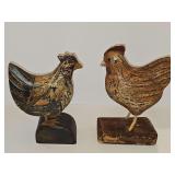 Two wood carved chickens. 9.25 and 10 in tall.