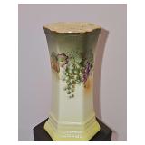 Hand-painted porcelain hat pin holder with grapes on hexagonal base. Andrea by Sadek. 4 5/8 inches tall.