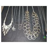 Silver tone necklaces.