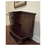 La Jolla 2 drawer bedroom nightstand Code B1033B-040. Ranchero Brown, hardwood solids and walnut veneer with bronze strap accents. Royal Classics by New Classic Furniture. Smooth full-extension ball-b