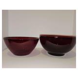 Two ruby red serving bowls. 9 in and 10 in diameters. 10 in diameter Bowl has a small pedestal.