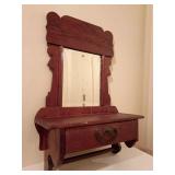 Antique wall-mounted shaving mirror, single razor drawer and towel dowel.