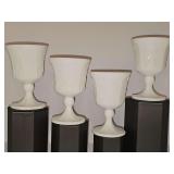 Four Indiana Glass Colony Harvest milk glass goblets with an embossed grape vine pattern. 5.5 in tall.
