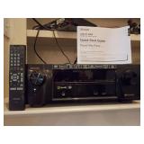 Denon AVR-X1100W Integrated Network AV Receiver, with Remote and Quick Start Guide. Currently hooked up. Power light is on.