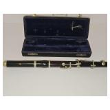 6-key simple-system wooden piccolo or band flute, crafted from a dark hardwood like grenadilla or ebony with nickel-silver keys and case. Marked C L.P. BRUNO