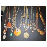 Earth tones costume necklaces. 20 in to 34 in.
