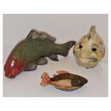 Three decorative fish. Coy, Pier 1 tea bag holder, and Happy fish Piggy bank.