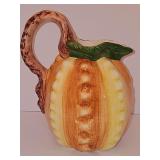 Hand painted Italian pouring pitcher. 10.25 in tall including handle