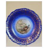 Schumann Arzberg, Bavaria Cobalt blue and gold-gilded porcelain decorative plate featuring two pheasants. 11.75 in diameter.