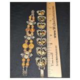 Two costume bracelets. The one on the right is Coro.