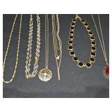 Gold tone necklaces.