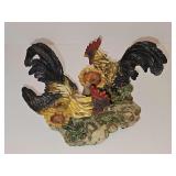 Cast resin roosters with sunflowers.