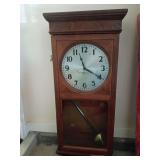 Antique electromechanical regulator wall pendulum clock made by the Self Winding Clock Company of New York. The case has some damage, the pendulum is disconnected, there appears to be a modern voltage