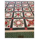 1 Completed Quilt, Vintage Impressions Green Floral Christmas Quilt, Baltimore Album-style layout, wreaths, bows, stars, baskets, and poinsettia motifs, deep hunter green, vibrant crimson red, and cre