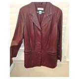 Preston & York single breasted hip length burgundy/brown leather jacket with two front pockets. Size 1X. In very good condition.