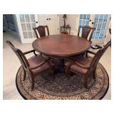 WOW - WOW - exquisite Haverty’s Furniture reversible top dining/game table with (4) well designed rolling arm chairs featuring faux leather seating and tooled backrests - this set is fabulous