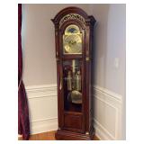 Beautiful cherry finish Howard Miller Traditional Grandfather Clock with Moon Dial, brass face and accents - serial 602714 - model 610-418 - 24 x 13-3/4 x 81 tall