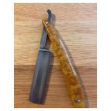 Vintage Royal Blue straight razor with amber marbled color bakelite handle