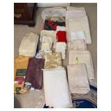 Very large grouping of fine table linens - runners, tablecloths, napkins